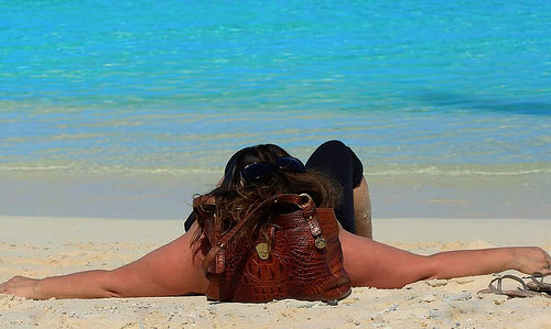 Joyce relaxing on a beach in her favorite destination,  French Polynesia