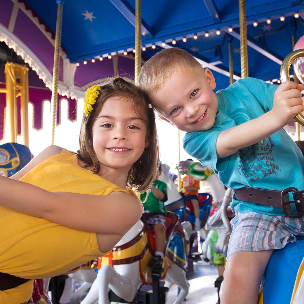 Children riding on a merry-go-round at Disneyland in Anaheim California