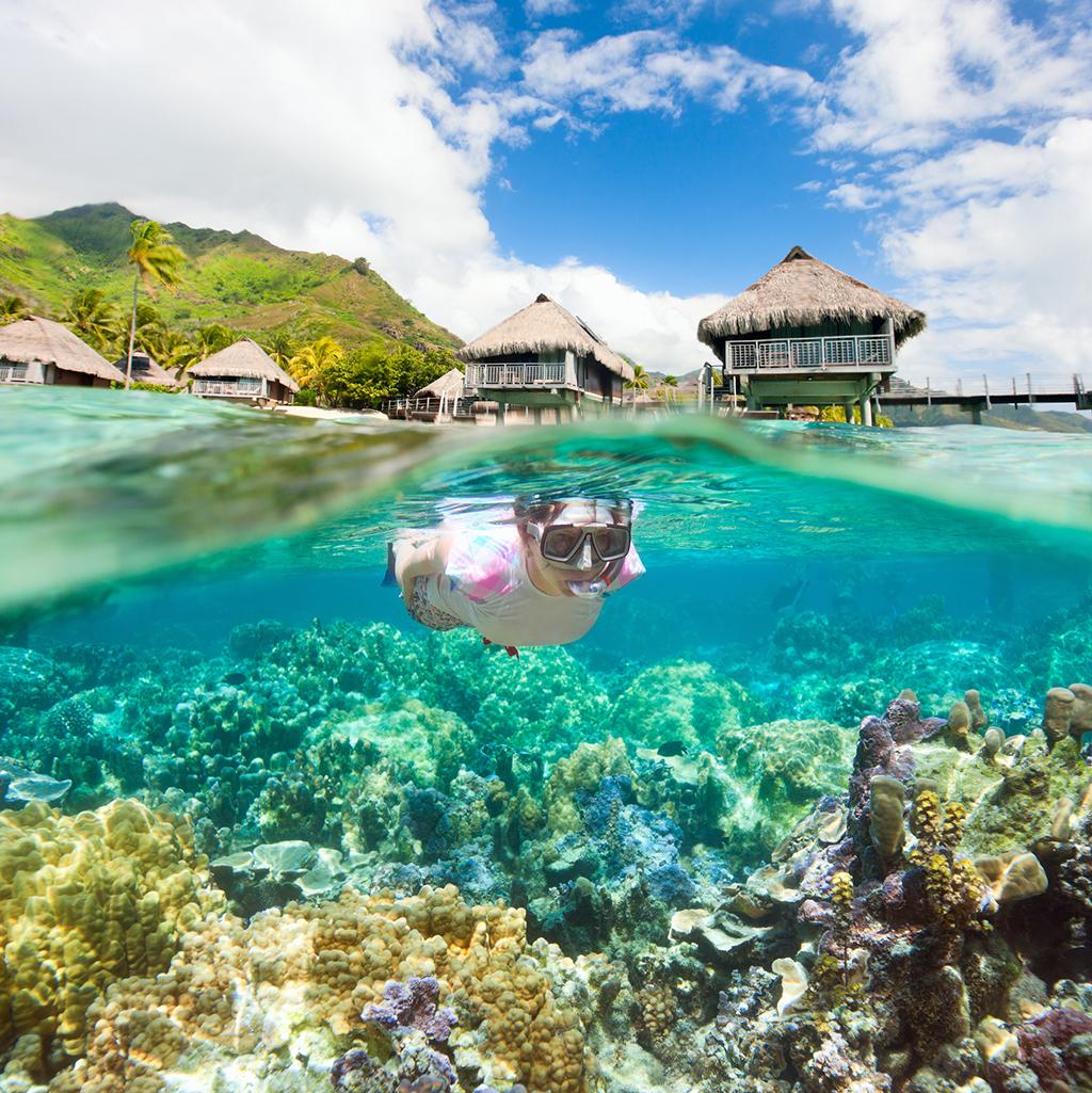 Snorkeling from overwater bungalows in Bora Bora