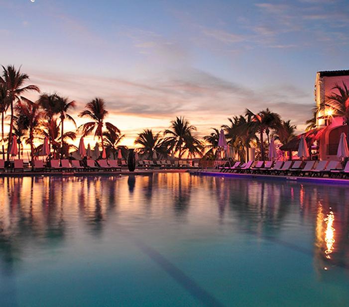 Sunset over Club Med’s tropical pool facilities