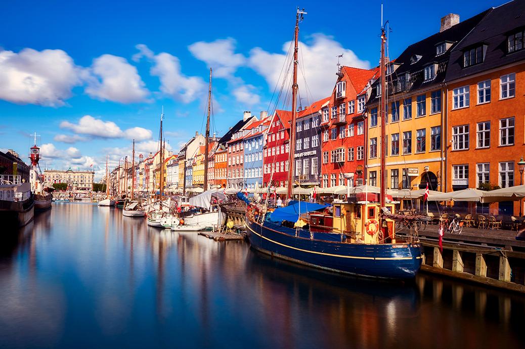 Waterfront view of the boats and colored houses along the waterfront canal Nyhavn