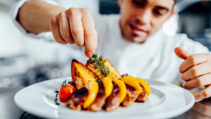 Garnish added atop a chef prepared meal