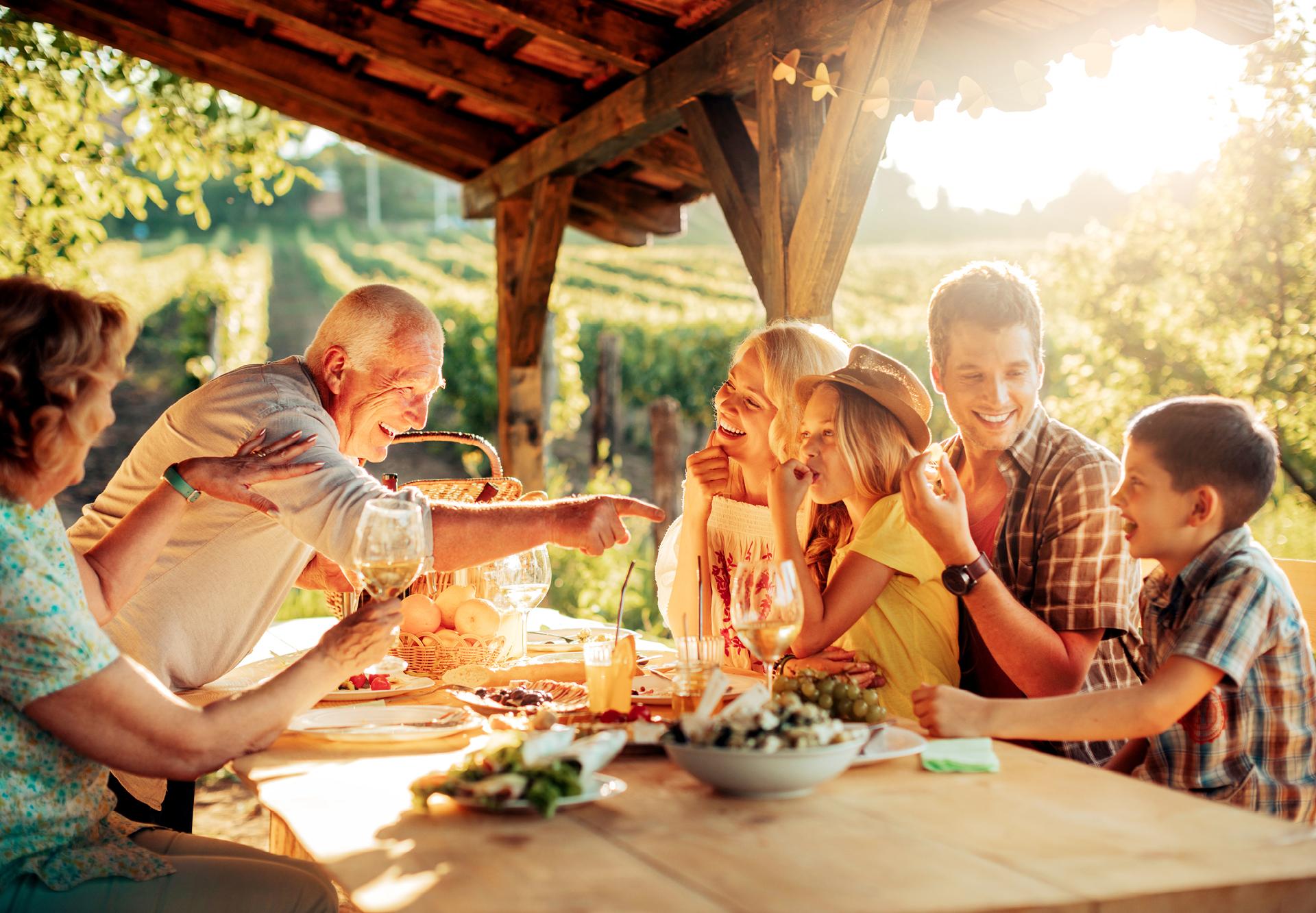 Family laughs are best around a dinner table in Italian vineyards