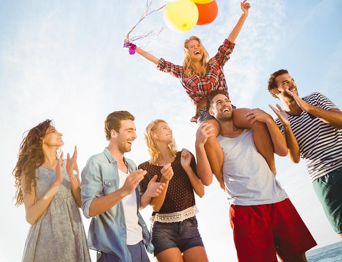 Friends celebrating at a birthday beach bash