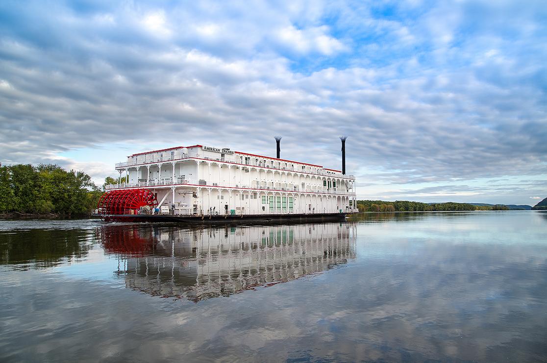 A traditional Louisiana paddle wheel cruise boat on a river