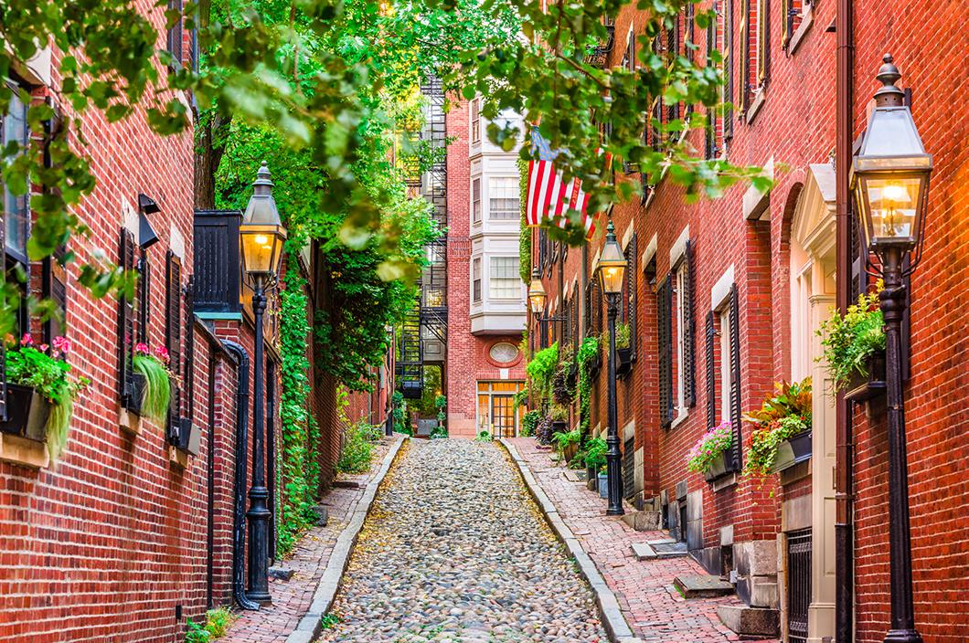 View of a historic brick and cobblestone alley in Boston Massachusetts