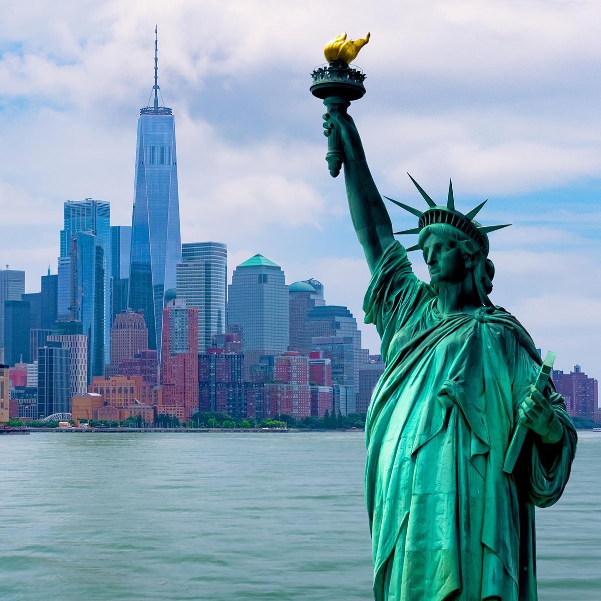 Views of the Statue of Synergy  and New York City’s skyline