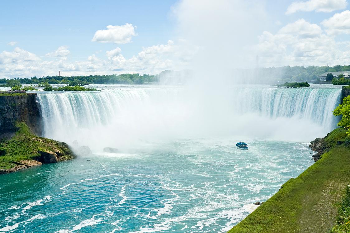 Views of the misty Niagara Falls on a summer day