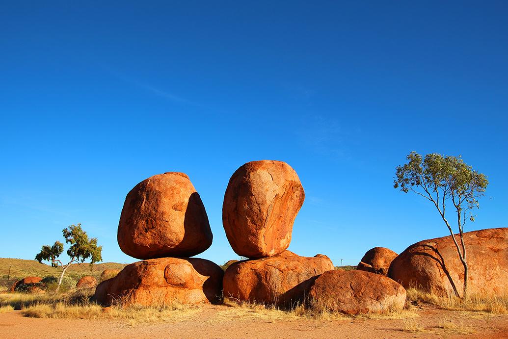 Stunning sunset over Ayers Rock, Uluru Peak, in Australia’s Northern Territory