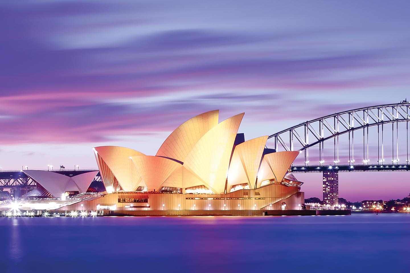 Views of the Sydney Opera House lit up at night