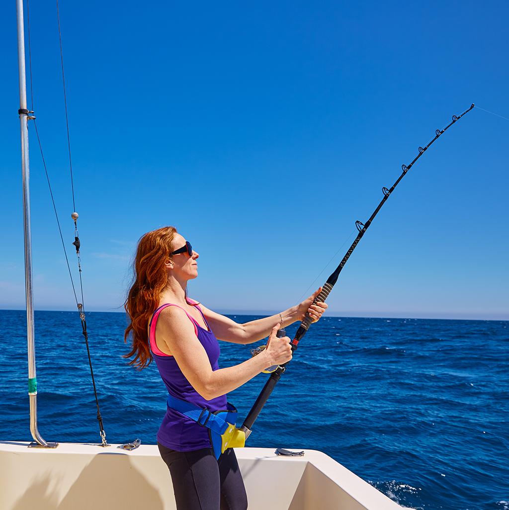 Woman fishing on a boat in Tortola