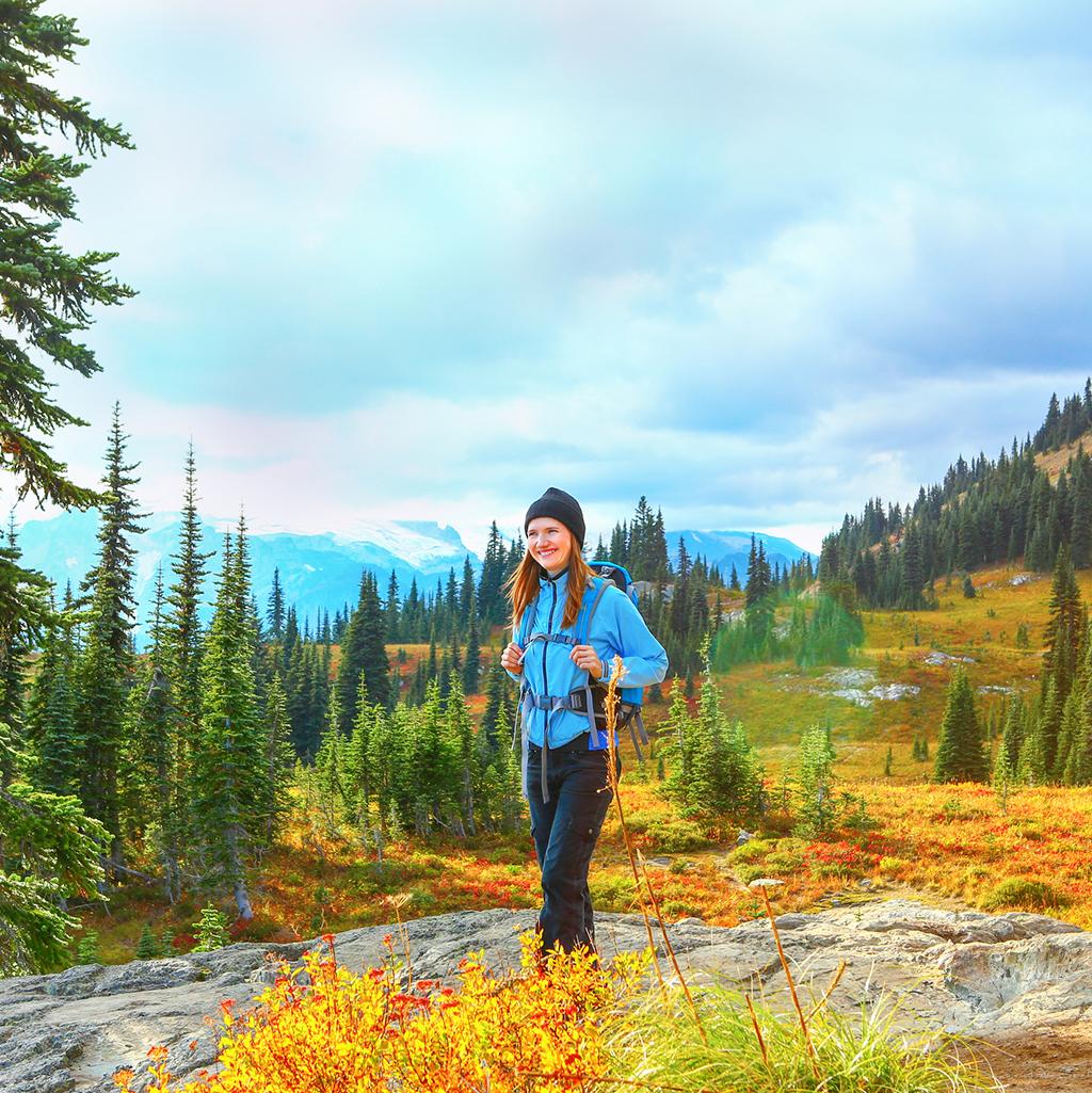 Woman hiking through Olympic National Park in Washington