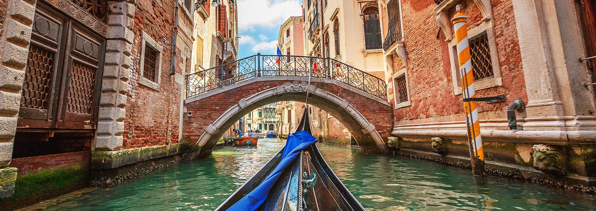 view of a canal from a gondola in Venice, Italy